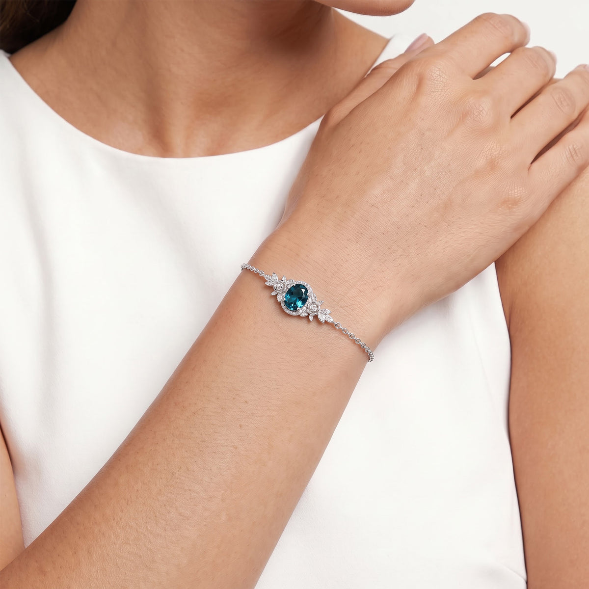 Enchanted Disney Fine Jewelry Sterling Silver with 1/20 CTTW Diamond and London Blue Topaz Cinderella Bracelet