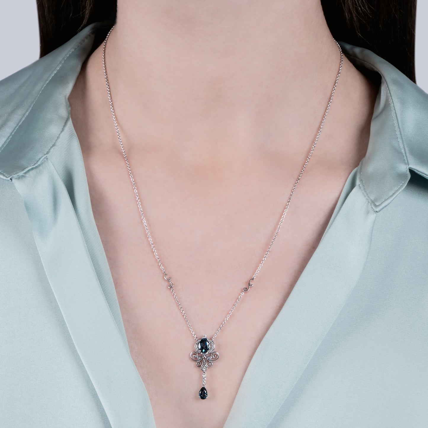 Enchanted Disney Fine Jewelry Sterling Silver with 1/10 CTTW Diamond and London Blue Topaz Cinderella Necklace