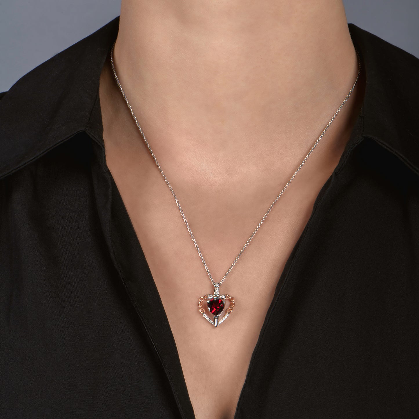 Enchanted Disney Fine Jewelry Sterling Silver and 10K Rose Gold with 1/10 CTTW Diamond and Garnet Evil Queen Pendant Necklace
