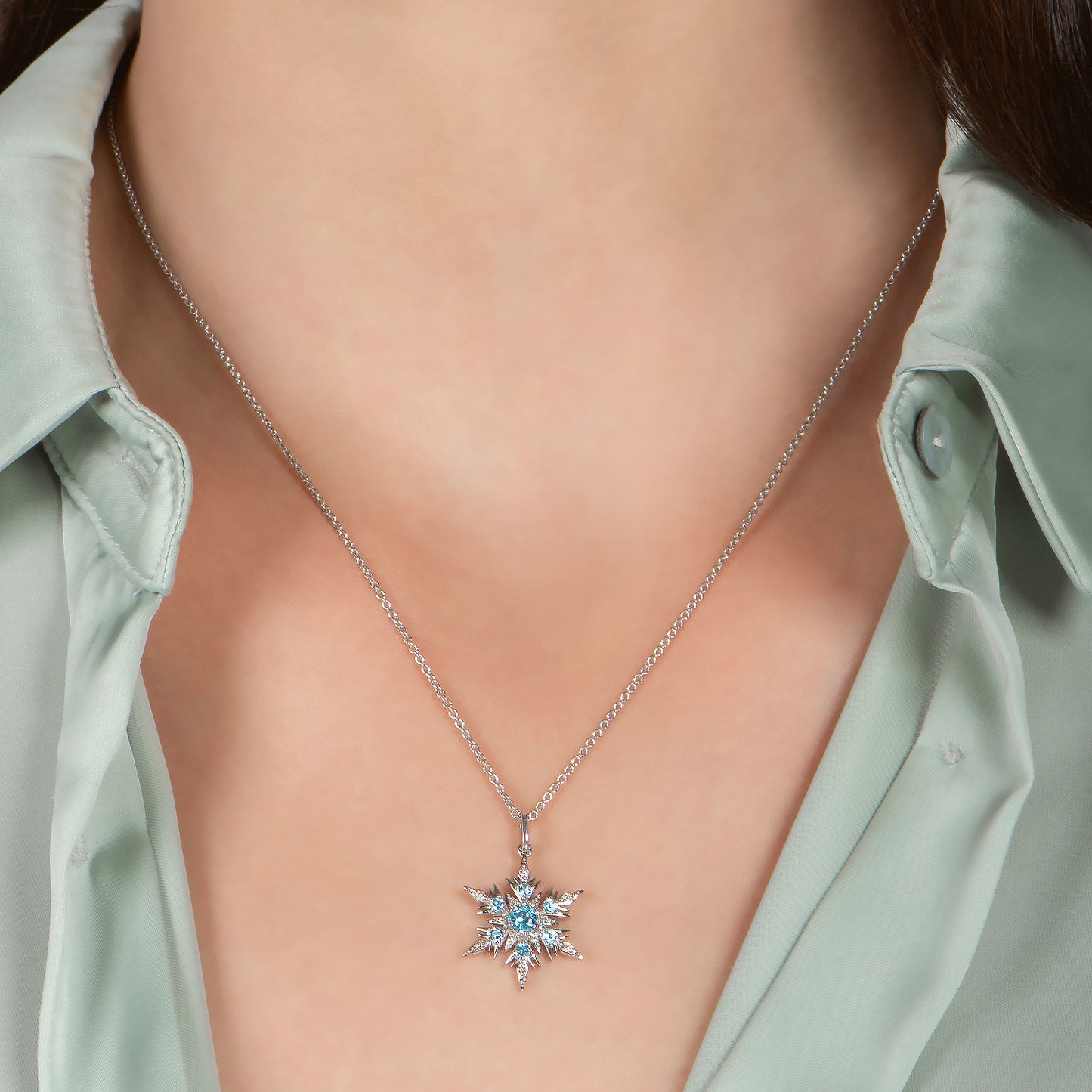 Enchanted Disney Fine Jewelry Sterling Silver with 1/10 CTTW Diamond and Swiss Blue Topaz Elsa Pendant Necklace