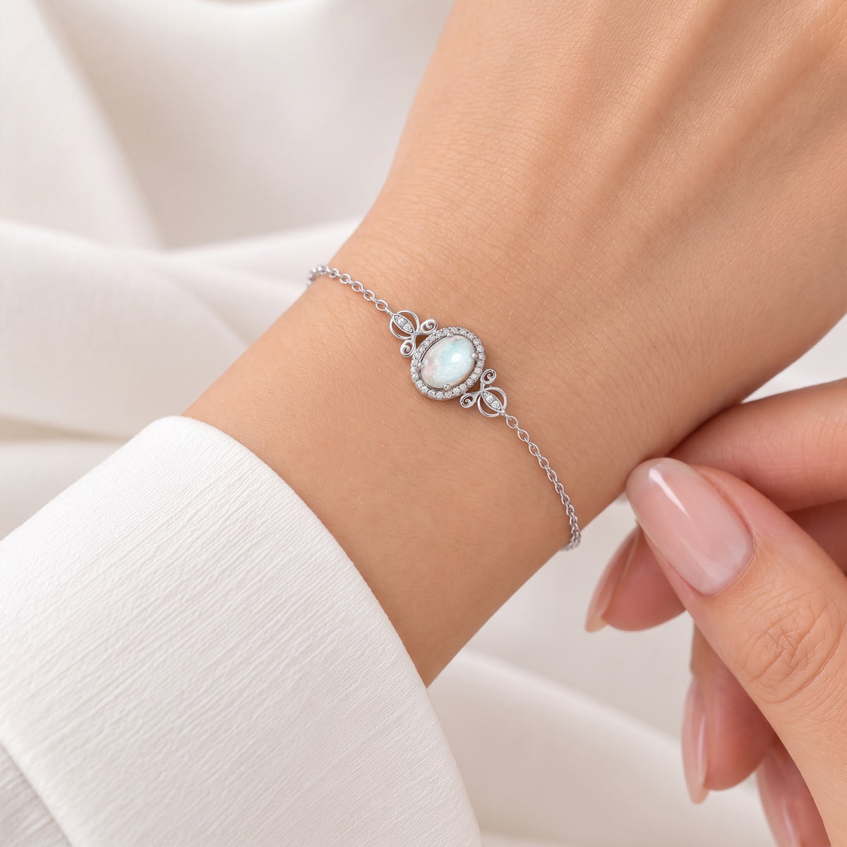 Enchanted Disney Fine Jewelry Sterling Silver with 1/10 CTTW Diamonds and Lab Grown Opal Cinderella Carriage Bracelet