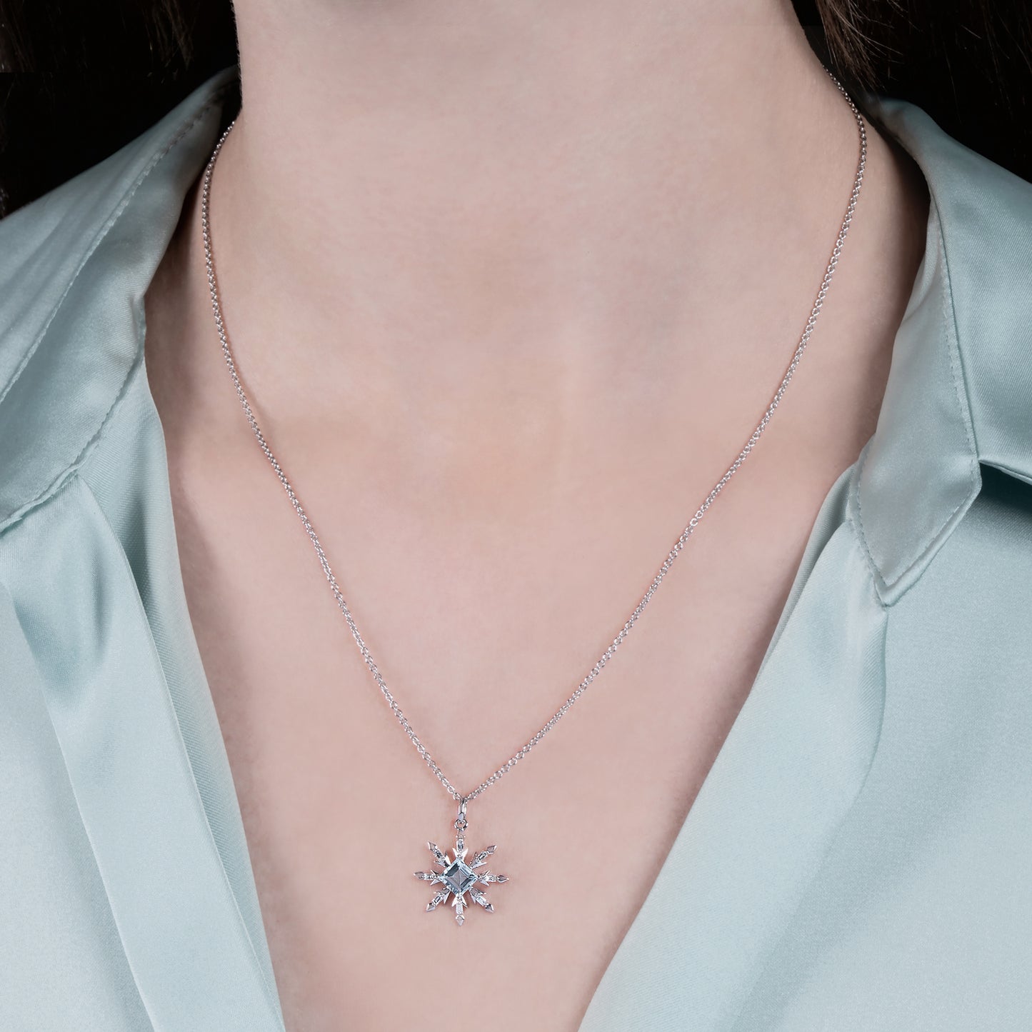 Enchanted Disney Fine Jewelry Sterling Silver with 1/10 CTTW Diamond and Aquamarine Elsa Snowflake Pendant Necklace