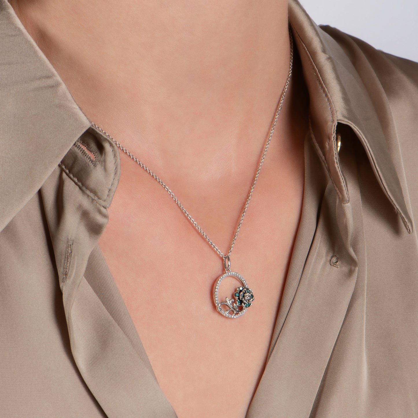 Enchanted Disney Fine Jewelry Sterling Silver with 1/6 CTTW Diamonds and London Blue Topaz, Disney's Cinderella Pendant Necklace