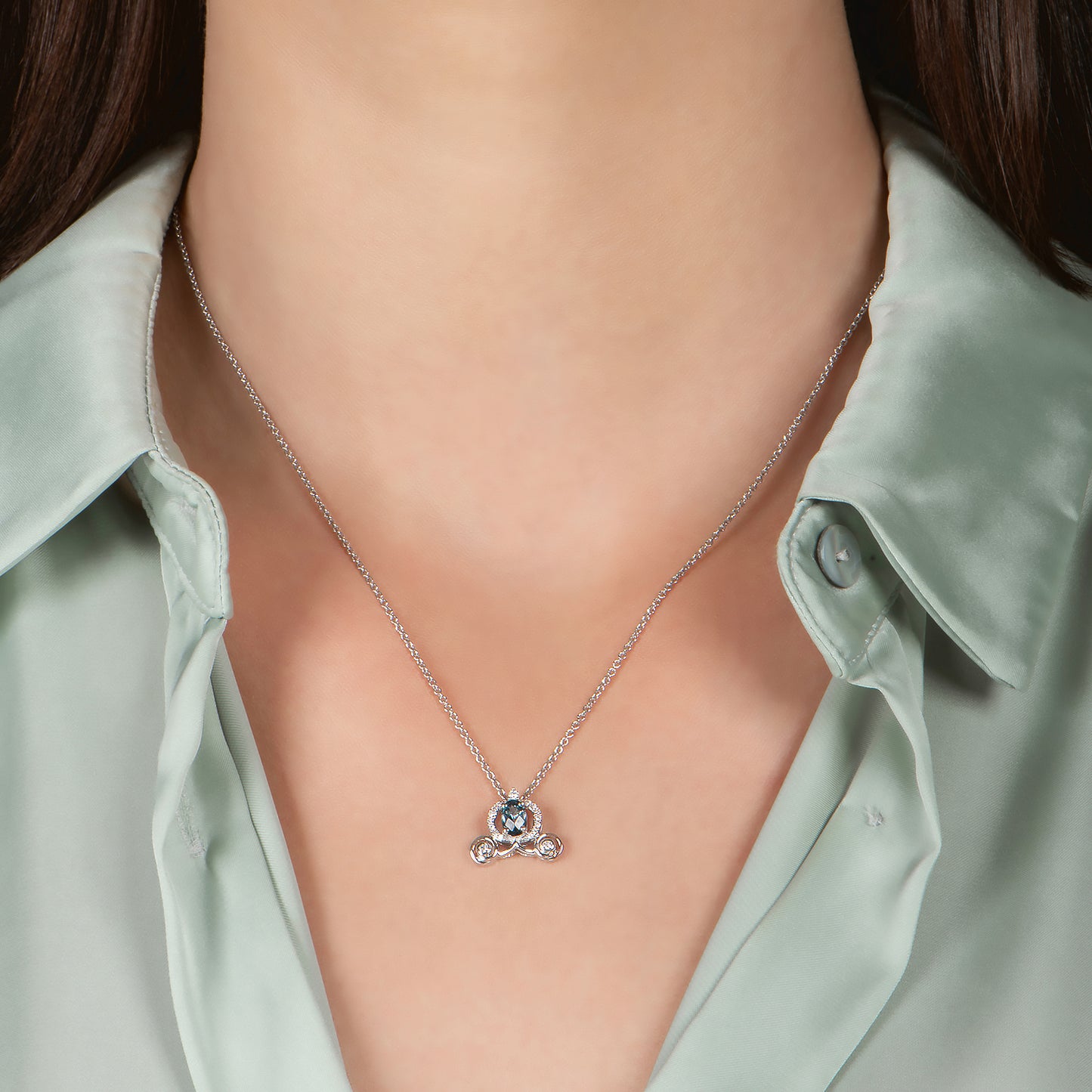 Enchanted Disney Fine Jewelry Sterling Silver 1/10 CTTW Diamond and London Blue Topaz Cinderella Carriage Pendant Necklace