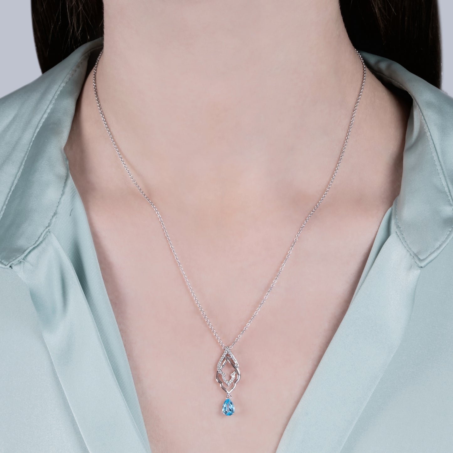 Enchanted Disney Fine Jewelry Sterling Silver with 1/10 CTTW Diamond and Swiss Blue Topaz Jasmine Pendant Necklace