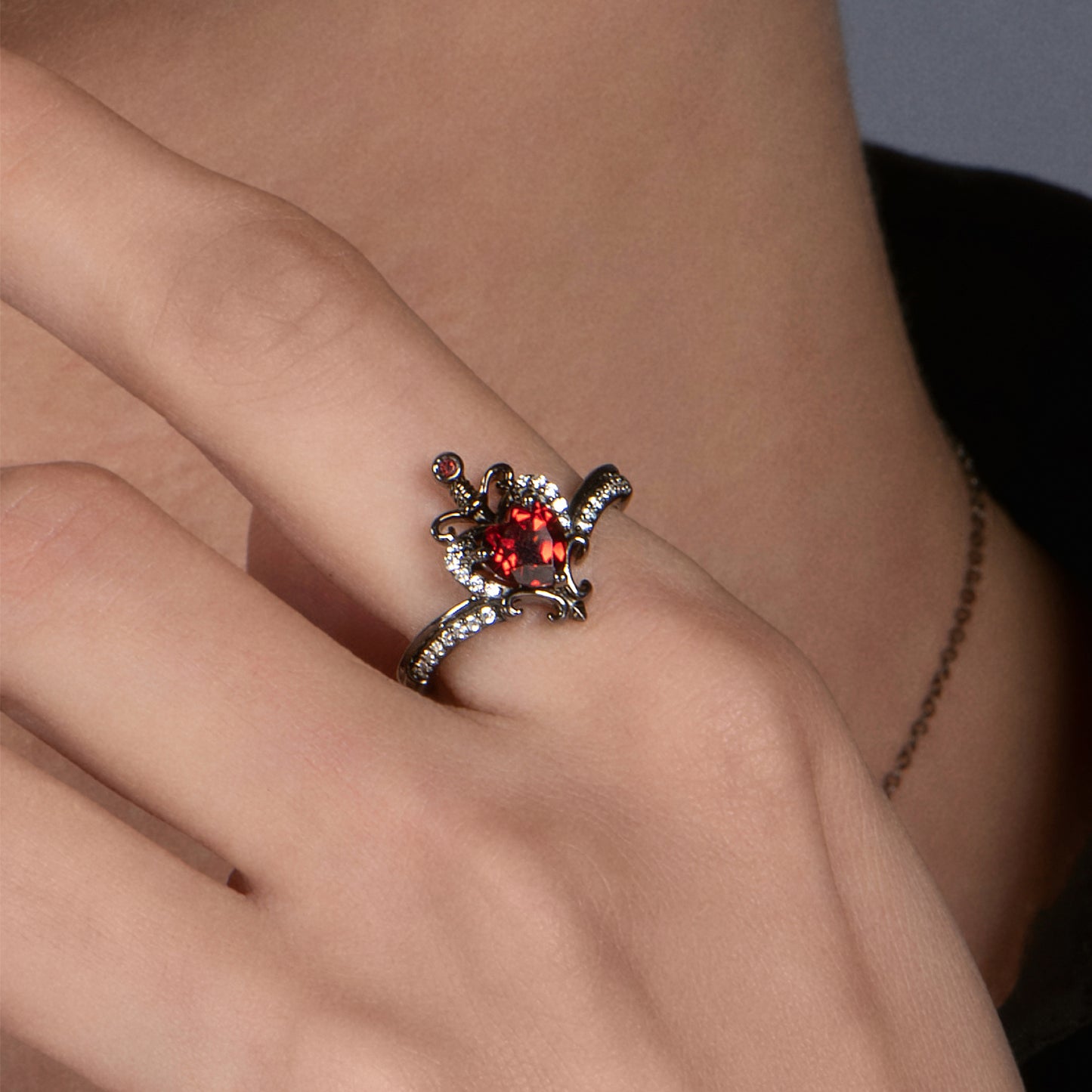 Enchanted Disney Fine Jewelry Black Rhodium over Sterling Silver Evil Queen with 1/10 CTTW Diamond and Red Garnet Dagger Ring